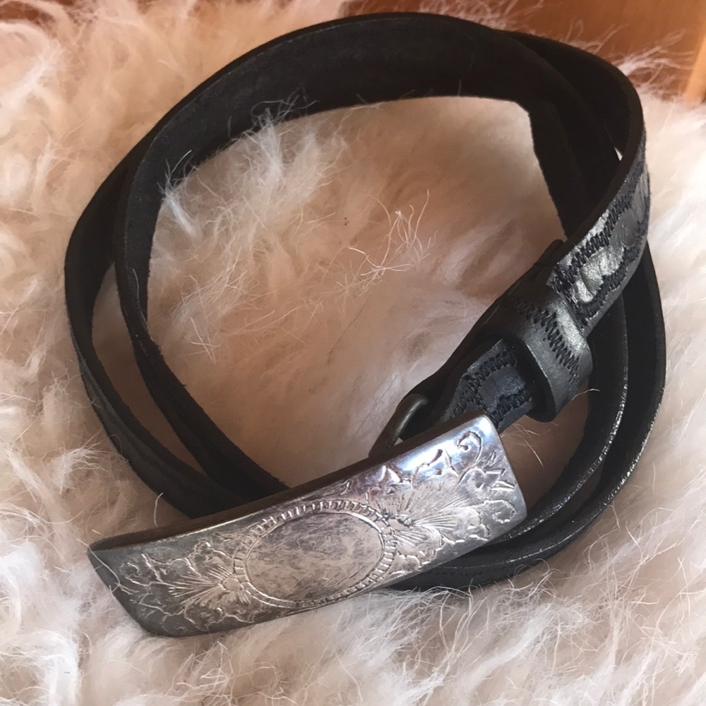 Black leather belt with silver buckle